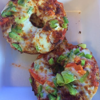 Bagel Cafe - Pizza bagel on an everything bagel with green and red bell peppers. Yummy and filling! - Bagels Near Me - Herndon, Virginia Bagel Cafe - Pizza bagel on an everything bagel with green and red bell peppers. Yummy and filling! - Bagels Near Me - Herndon, Virginia