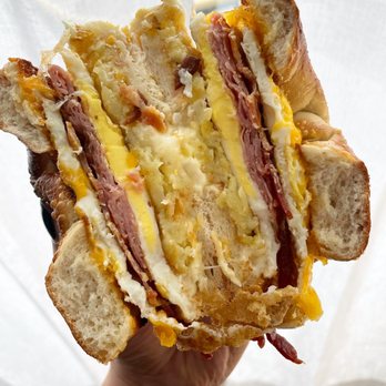 Deke's Bagels - a hand holding a sandwich - Bagels Near Me - Guilford, Connecticut