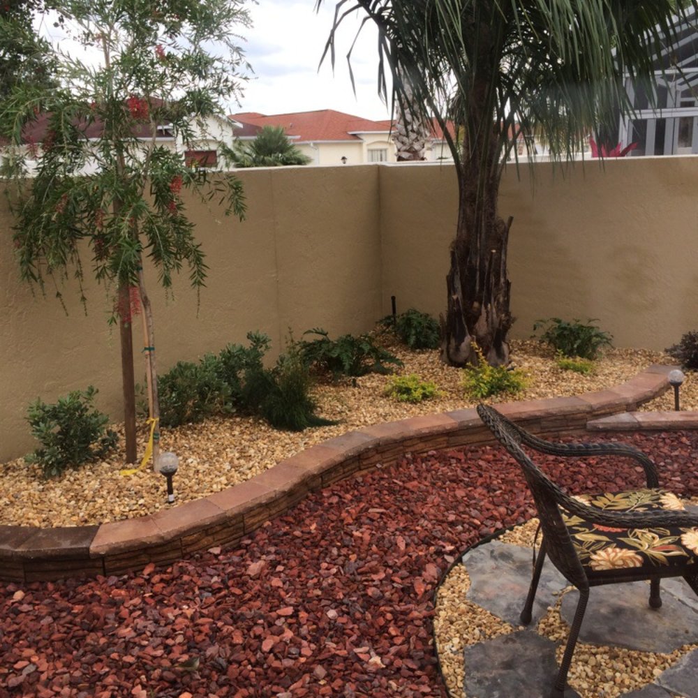Mansfield Landscaping - Patio of flagstone in courtyard - Landscaping Near Me - Yalaha, Florida Mansfield Landscaping - Patio of flagstone in courtyard - Landscaping Near Me - Yalaha, Florida
