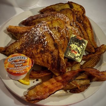 Cheeser's Palace Cafe - Full order of challah French toast with side of bacon and potato wedges. - Breakfast & Brunch Near Me - Clermont, Florida Cheeser's Palace Cafe - Full order of challah French toast with side of bacon and potato wedges. - Breakfast & Brunch Near Me - Clermont, Florida