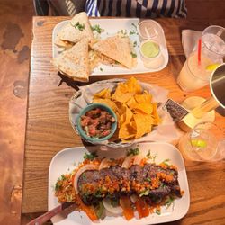 Chicken quesadillas and churrasco steak meal. Along with the complimentary nachos that they give you.