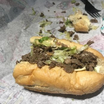 Wawa - a half eaten sandwich on a table - Gas Stations Near Me - Williamsburg, Virginia Wawa - a half eaten sandwich on a table - Gas Stations Near Me - Williamsburg, Virginia