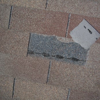 Precision Inspection - poorly stapled and wind damaged shingle - Home Inspectors Near Me - Austin, Texas