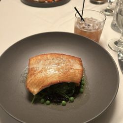 Halibut with black rice, shrimp and peas