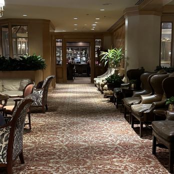 The Grill Room - a long line of chairs and tables - New American Near Me - New Orleans, Louisiana