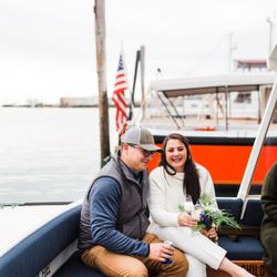 Casco Bay Custom Charters - Newlywed couple about to say their vows at sea.