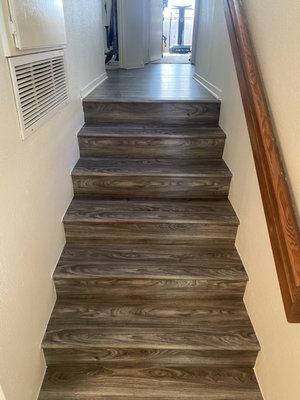 New vinyl flooring - Customer had water damage in their existing floors, so they needed a fast and affordable way of adding new floors with baseboard included. New vinyl flooring - Customer had water damage in their existing floors, so they needed a fast and affordable way of adding new floors with baseboard included.