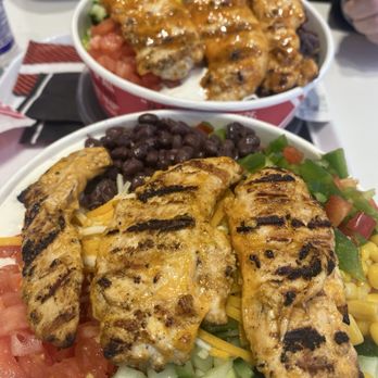 Poulet Rouge - Two rouge bowls  Mine is with sweet bbq chicken Husbands with shisha garlic chicken - Chicken Shop Near Me - Oshawa, Ontario