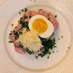 Told og Snaps - Smørrebrød: Herring Salad with beetroot, apple, horseradish and egg on butter toasted bread.