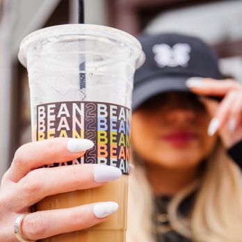 HomeGrown215 - a woman holding a cup of coffee - Coffee & Tea Near Me - Philadelphia, Pennsylvania