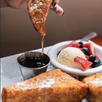 The Nest Cafe - a person dipping a scoop of ice cream into a dessert - Breakfast & Brunch Near Me - Milton, Georgia The Nest Cafe - a person dipping a scoop of ice cream into a dessert - Breakfast & Brunch Near Me - Milton, Georgia