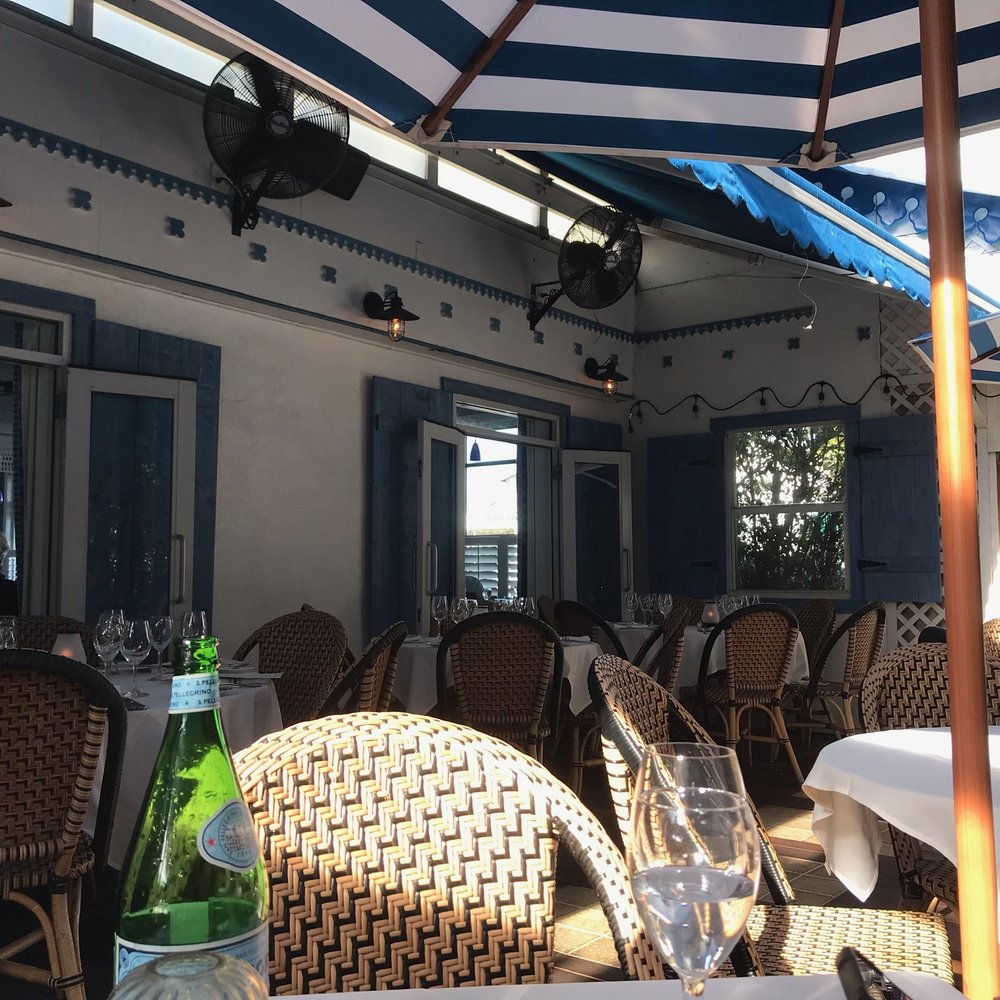 Bleu Provence - Quaint patio section if you walk through the restaurant, past the bar in the back. - French Near Me - Naples, Florida Bleu Provence - Quaint patio section if you walk through the restaurant, past the bar in the back. - French Near Me - Naples, Florida