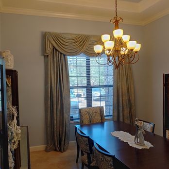 Carpet Barn & More - a dining room with a chandelier - Flooring Near Me - Largo, Florida Carpet Barn & More - a dining room with a chandelier - Flooring Near Me - Largo, Florida