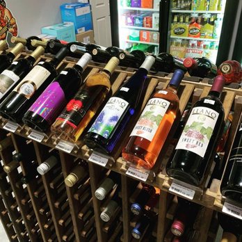 CP's Liquor - a rack of wine bottles - Beer, Wine & Spirits Near Me - Pearland, Texas