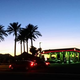 a gas station with palm trees in the background a gas station with palm trees in the background