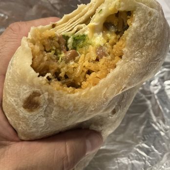 Xinantecatl Restaurant - First bite of the carne asada burrito. - American Near Me - Fresno, California Xinantecatl Restaurant - First bite of the carne asada burrito. - American Near Me - Fresno, California