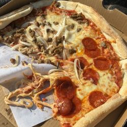 Pizza Town - This is all we ate out of 3 of us and it looked like it was tossed around in a Clothes Dryer for a Day or so!