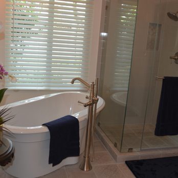 Alpha Tile - New shower is larger than the previous one. Replaced the tub with a freestanding one and added a beautiful faucet. - General Contractors Near Me