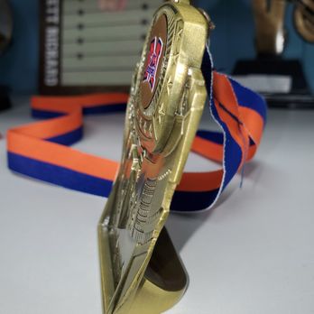aai Trophies & Awards - Stand up or wear around your neck stadium medal. Center insert can be custom to your team logo! - Trophy Shops Near Me - Plano, Texas aai Trophies & Awards - Stand up or wear around your neck stadium medal. Center insert can be custom to your team logo! - Trophy Shops Near Me - Plano, Texas