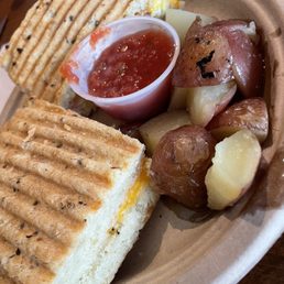 Breakfast panini with ham/eggs/cheese and potatoes/salsa. Breakfast panini with ham/eggs/cheese and potatoes/salsa.