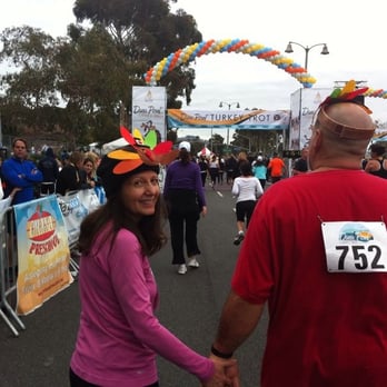 Dana Point Turkey Trot - My mom and dad just about to cross the 5K finish line! - Races & Competitions Near Me - Dana Point, California