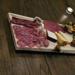 Downtown Winery - Charcuterie board with assorted deli meats, cheese, olives, and biscotti