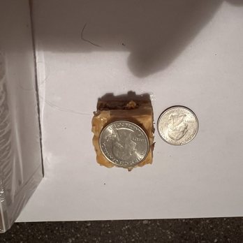 Swiss Colony - The actual size of one piece. Compared to a quarter. - Cheese Shops Near Me - Monroe, Wisconsin