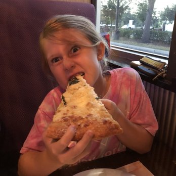 Mellow Mushroom Sanford - Daughter being silly while eating white pizza - Pizza Near Me - Sanford, Florida
