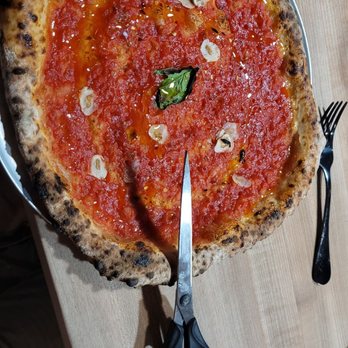 Osteria DOP - Marinara pizza, yes that is a pair of scissors to cut it with. - Italian Near Me - Eugene, Oregon Osteria DOP - Marinara pizza, yes that is a pair of scissors to cut it with. - Italian Near Me - Eugene, Oregon