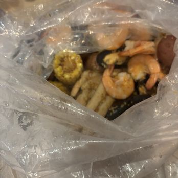 Mr. Crab House - The boil came out wrapped in a plastic bag which kept everything hot until we were ready to eat - Seafood Near Me - Cincinnati, Ohio