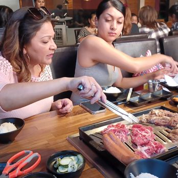 Wang Cho Korean BBQ - Family Picking Multiple BBQ Items - Korean Near Me - Riverside, California Wang Cho Korean BBQ - Family Picking Multiple BBQ Items - Korean Near Me - Riverside, California