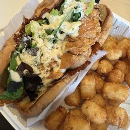 Chicken Caesar sandwich with tater tots