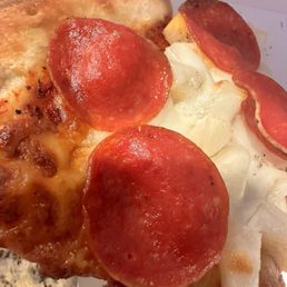 Old layer of cheese (dark) under new layer of cheese(lighter colored layer)/pepperoni/pineapple Old layer of cheese (dark) under new layer of cheese(lighter colored layer)/pepperoni/pineapple