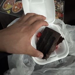 $8.99 for a 3/10 slice of tiny chocolate cake $8.99 for a 3/10 slice of tiny chocolate cake