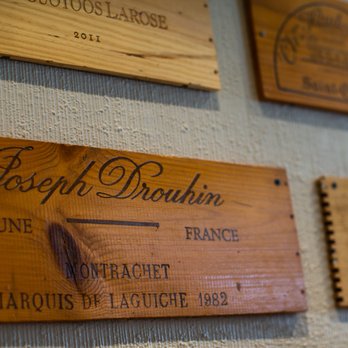 Le Castel - wooden plaques on a wall - American Near Me - Trois-Rivières, Quebec Le Castel - wooden plaques on a wall - American Near Me - Trois-Rivières, Quebec