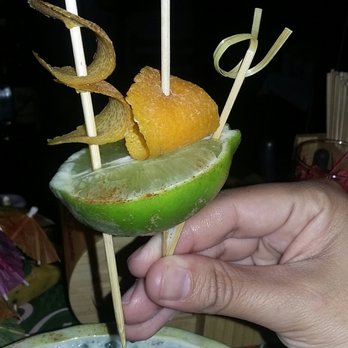 Lei Low - A lime ship with orange peel sails garnish! - Cocktail Bars Near Me - Houston, Texas