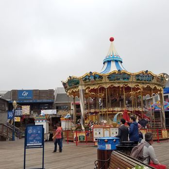 PIER 39 - Love the splash of color from the merry-go-round to brighten up this otherwise gray day. - Shopping Centers Near Me - San Francisco, California