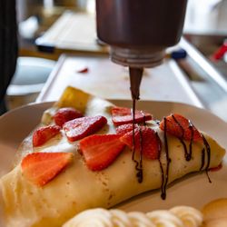 Crepes and Treats - They were making the strawberry crepe for us and my mouth was watering