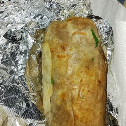 Tacos La Madrina - Carnitas burrito is tasty although a little greasy. Add the green salsa.
