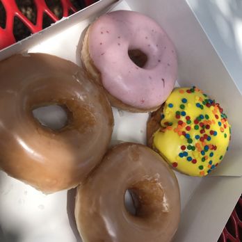 Krispy Kreme - Two original glazed, one strawberry glazed, and one birthday cake donut - Donuts Near Me - Austin, Texas Krispy Kreme - Two original glazed, one strawberry glazed, and one birthday cake donut - Donuts Near Me - Austin, Texas