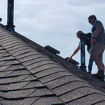 Safe and Secure Roofing and Construction - a man and a woman working on a roof - Roofing Near Me - Allen, Texas