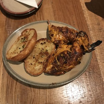 Nando's Peri-Peri - 1/2 chicken with hot sauce and garlic bread side ($13.39) - South African Near Me - Chicago, Illinois Nando's Peri-Peri - 1/2 chicken with hot sauce and garlic bread side ($13.39) - South African Near Me - Chicago, Illinois