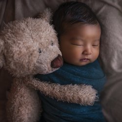 BACINI Photography - Newborn Baby Snuggling with Teddy Bear