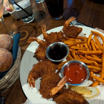 Pelican's West - Sweet potatoes fries and coconut shrimp. The pelican - Seafood Near Me - Albuquerque, New Mexico