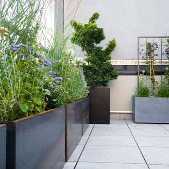 Brooklinteriors - Brooklyn outdoor terrace design by Brooklinteriors with plantscaping by Dirt Queen NYC - Interior Design Near Me