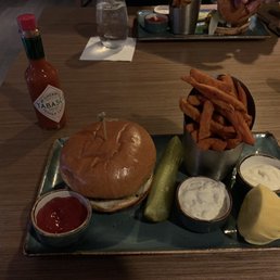a burger and fries on a plate a burger and fries on a plate
