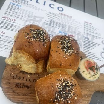 Calico Fish House - Rolls with lobster butter. 99.9% butter with a tiny lobster garnish. Bread was toasted, dry and a total DISAPPOINTMENT, especially for $12 - Seafood Near Me - Huntington Beach, California Calico Fish House - Rolls with lobster butter. 99.9% butter with a tiny lobster garnish. Bread was toasted, dry and a total DISAPPOINTMENT, especially for $12 - Seafood Near Me - Huntington Beach, California