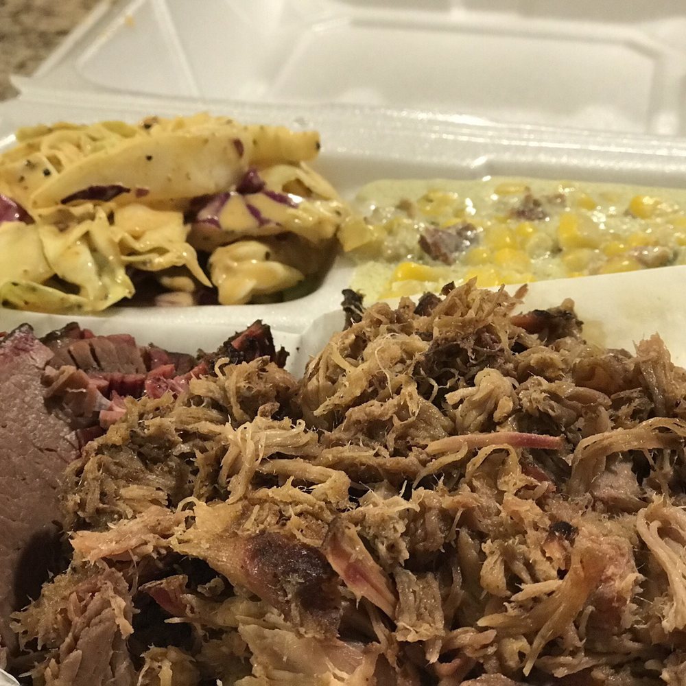 2-meat combo: brisket (left) and pulled pork (right) with tangy slaw and jalapeño creamed corn sides. Sooooo good! 2-meat combo: brisket (left) and pulled pork (right) with tangy slaw and jalapeño creamed corn sides. Sooooo good!
