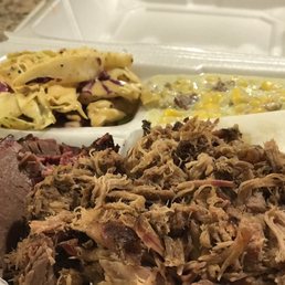 2-meat combo: brisket (left) and pulled pork (right) with tangy slaw and jalapeño creamed corn sides. Sooooo good! 2-meat combo: brisket (left) and pulled pork (right) with tangy slaw and jalapeño creamed corn sides. Sooooo good!