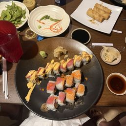 Rainbow and Earthquake rolls with edamame and spring rolls. Rainbow and Earthquake rolls with edamame and spring rolls.